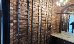 This custom for the ceiling wine rack is made out of heavy gauge steel